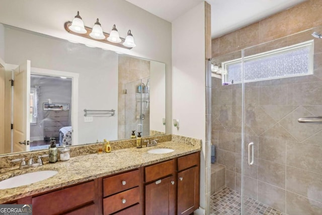 bathroom featuring vanity and an enclosed shower