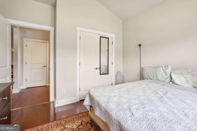 bathroom featuring hardwood / wood-style floors, vanity, and shower / bath combination