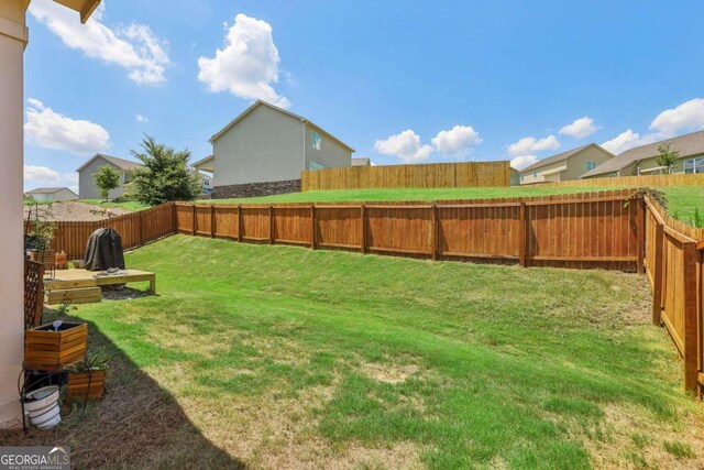 rear view of property featuring a sunroom and a lawn