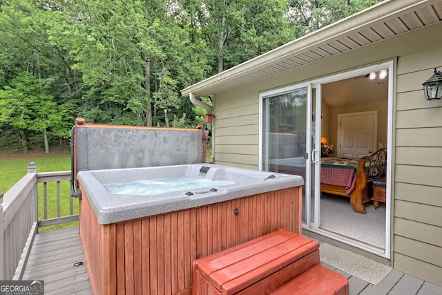 deck featuring a hot tub