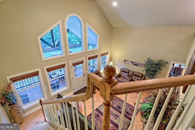 interior space featuring high vaulted ceiling and hardwood / wood-style floors