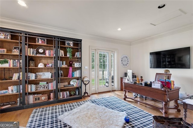 home office with ornamental molding and wood-type flooring