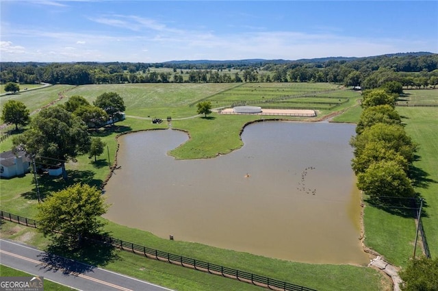 aerial view with a rural view and a water view