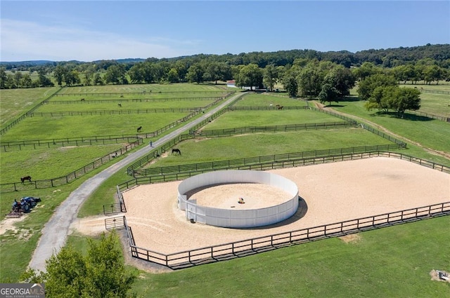 birds eye view of property with a rural view