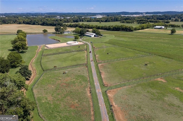 drone / aerial view featuring a rural view and a water view