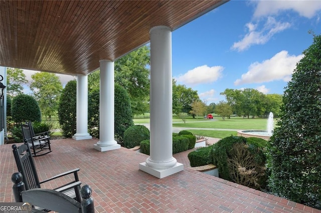 view of patio featuring a porch