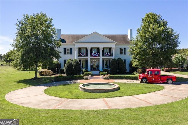 view of community featuring a lawn