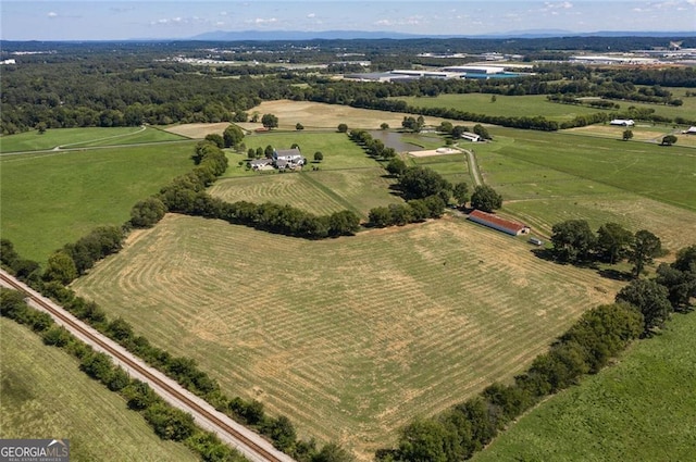 birds eye view of property with a rural view