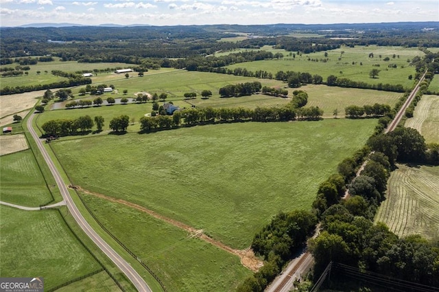 birds eye view of property with a rural view