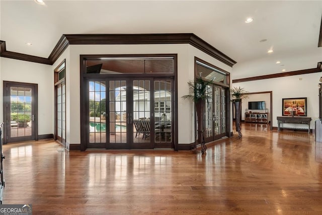 doorway featuring french doors and crown molding