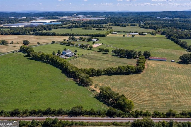 birds eye view of property with a rural view