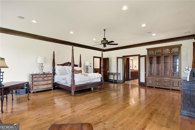 bedroom with ensuite bathroom, ceiling fan, ornamental molding, and hardwood / wood-style floors