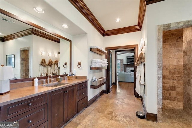 bathroom featuring walk in shower, vanity, and ornamental molding