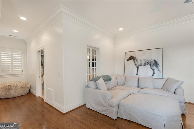 living room featuring crown molding and wood-type flooring