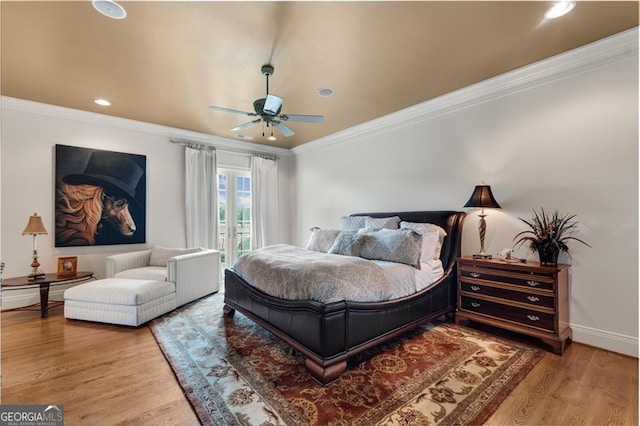 bedroom with ceiling fan, access to exterior, wood-type flooring, crown molding, and french doors