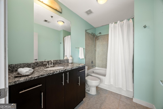 full bathroom with shower / tub combo, vanity, tile patterned floors, and toilet