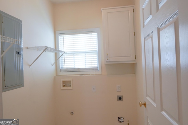 washroom featuring electric dryer hookup, hookup for a washing machine, cabinets, and hookup for a gas dryer