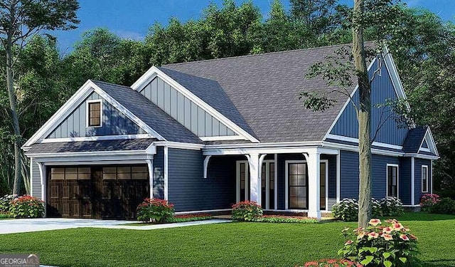 view of front of house with a garage and a front yard