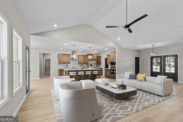 831 Banks Cir, Carrollton, GA 30116 - living area featuring light wood-type flooring, recessed lighting, high vaulted ceiling, a ceiling fan, and baseboards
