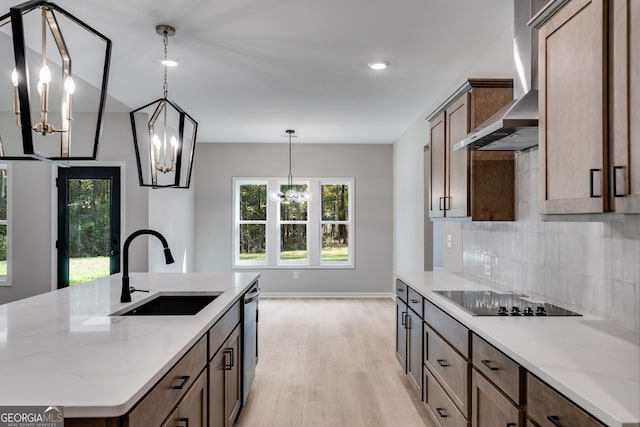 831 Banks Cir, Carrollton, GA 30116 - kitchen with a sink, a chandelier, black electric stovetop, tasteful backsplash, and stainless steel dishwasher
