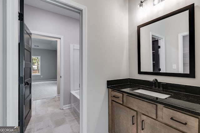 bathroom featuring vanity and a bathtub