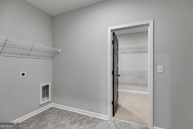 laundry area with hookup for an electric dryer and carpet