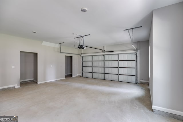 831 Banks Cir, Carrollton, GA 30116 - garage with a garage door opener and baseboards