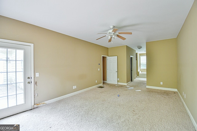 spare room with light carpet and ceiling fan