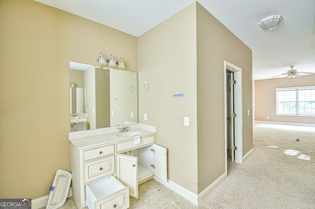 bathroom featuring vanity, ceiling fan, and tile patterned flooring