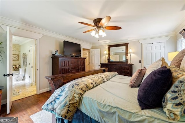 bedroom with ceiling fan, ornamental molding, and dark hardwood / wood-style floors