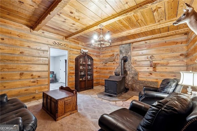 living room with wooden ceiling, a wood stove, log walls, and beamed ceiling