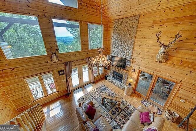 living room featuring high vaulted ceiling and hardwood / wood-style flooring