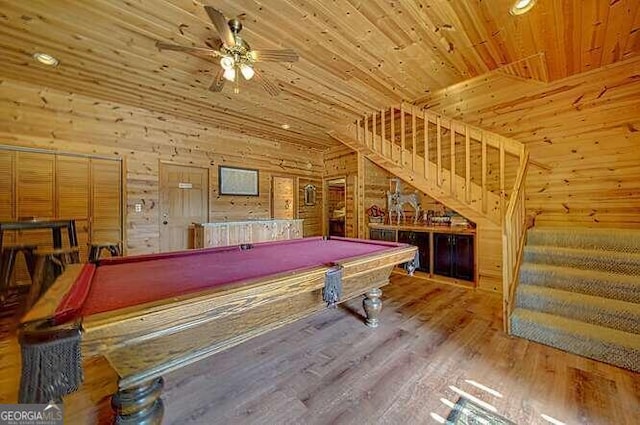 rec room featuring wood walls, pool table, wood ceiling, ceiling fan, and hardwood / wood-style floors