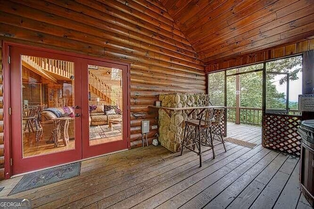 sunroom featuring french doors, lofted ceiling, and wooden ceiling