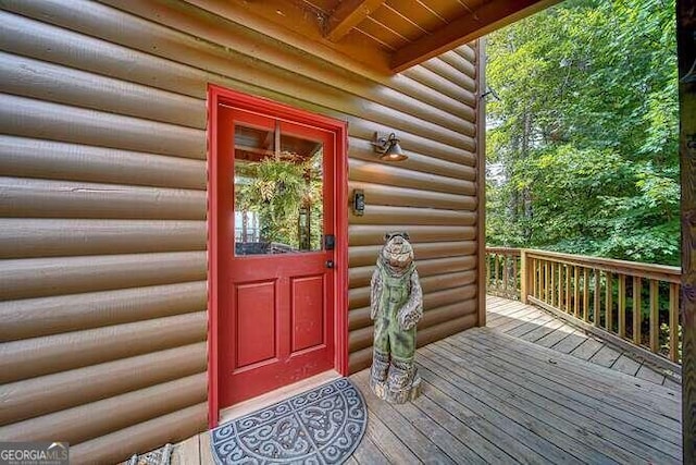 doorway to property with a deck