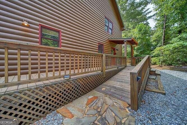 view of side of property with a deck