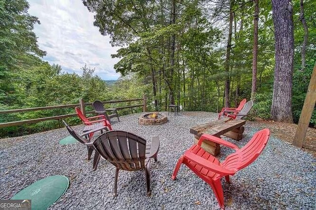 exterior space featuring an outdoor fire pit