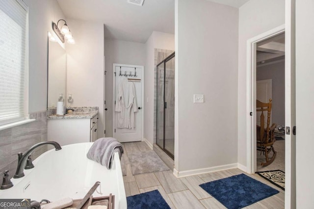 bathroom featuring vanity, a wealth of natural light, and an enclosed shower