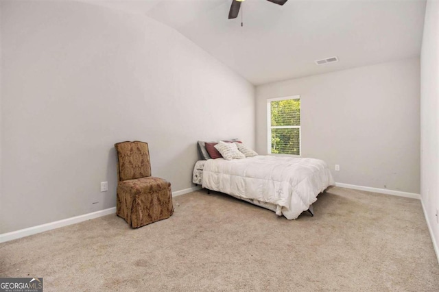 bedroom with light carpet, vaulted ceiling, and ceiling fan