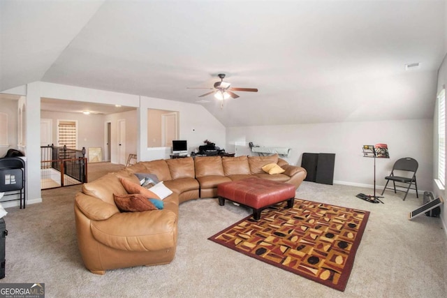 living room with lofted ceiling, carpet floors, and ceiling fan