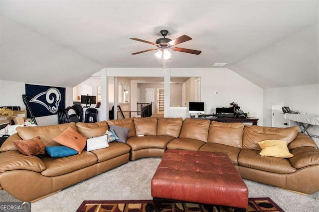 carpeted living room with vaulted ceiling and ceiling fan