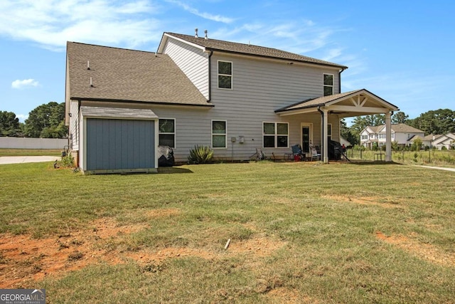 rear view of house with a yard