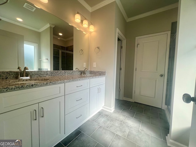 bathroom featuring dual vanity, tile patterned flooring, and crown molding