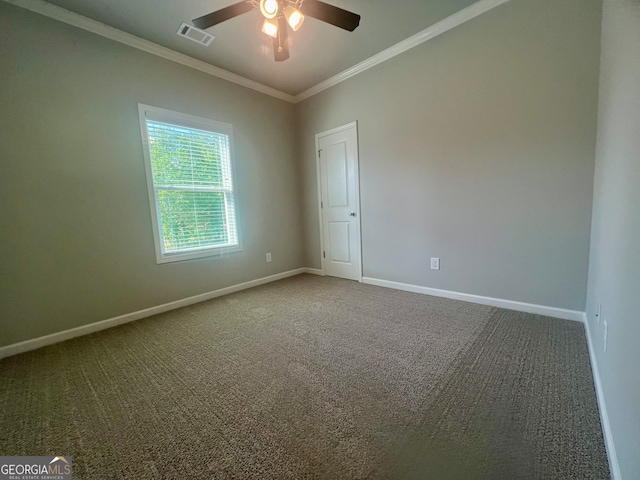 carpeted empty room with ceiling fan and crown molding