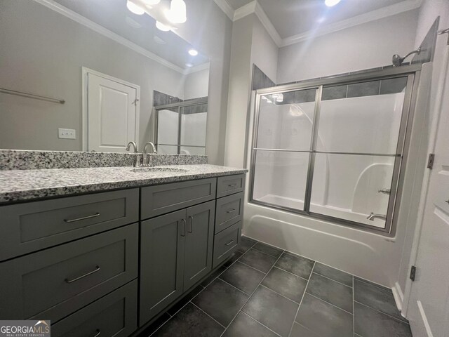 bathroom with vanity, tile patterned flooring, enclosed tub / shower combo, and ornamental molding