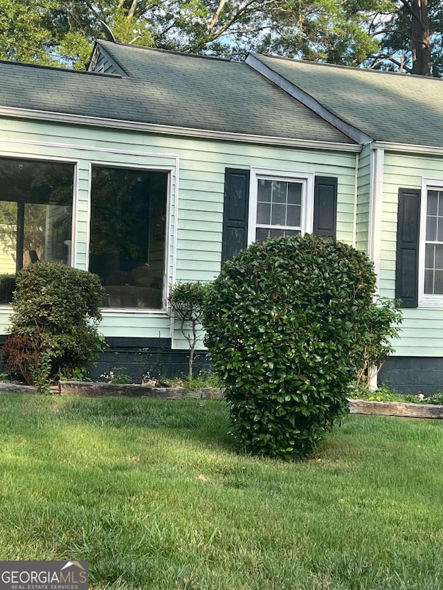 view of property exterior featuring a yard