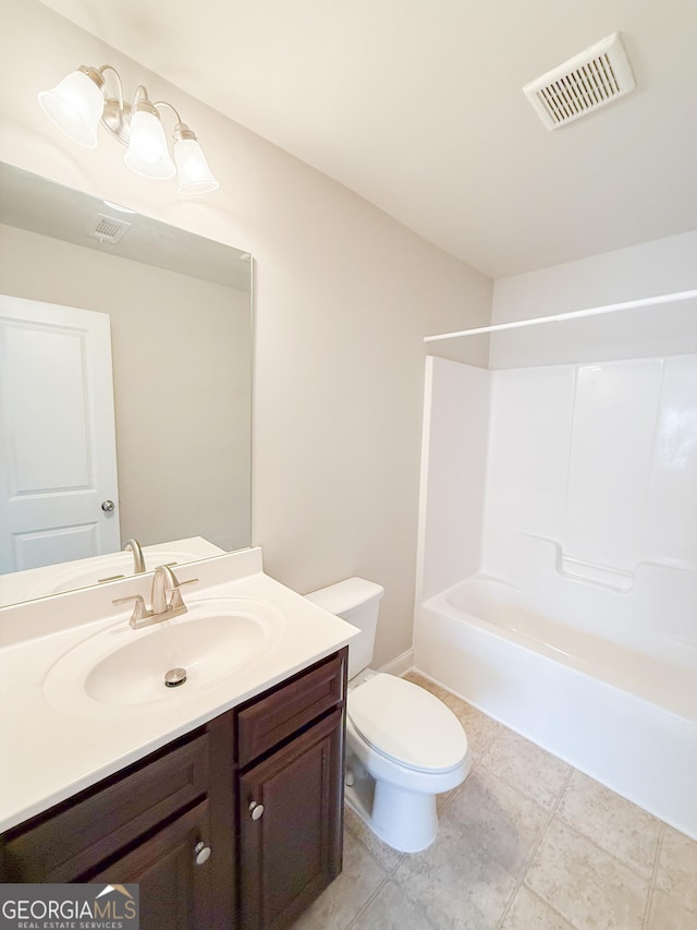 full bathroom featuring tile patterned floors, vanity, toilet, and shower / bath combination