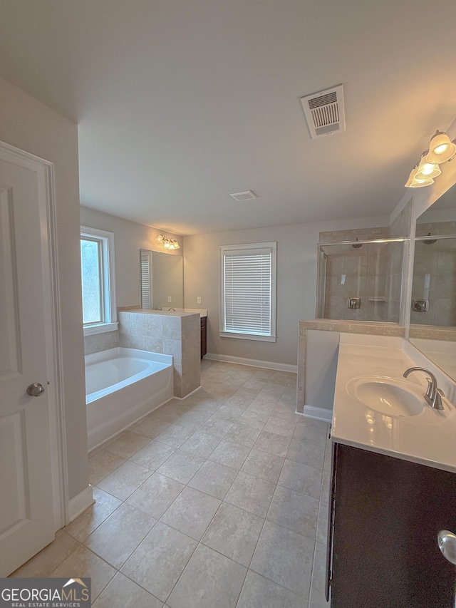 bathroom with vanity, independent shower and bath, and tile patterned flooring