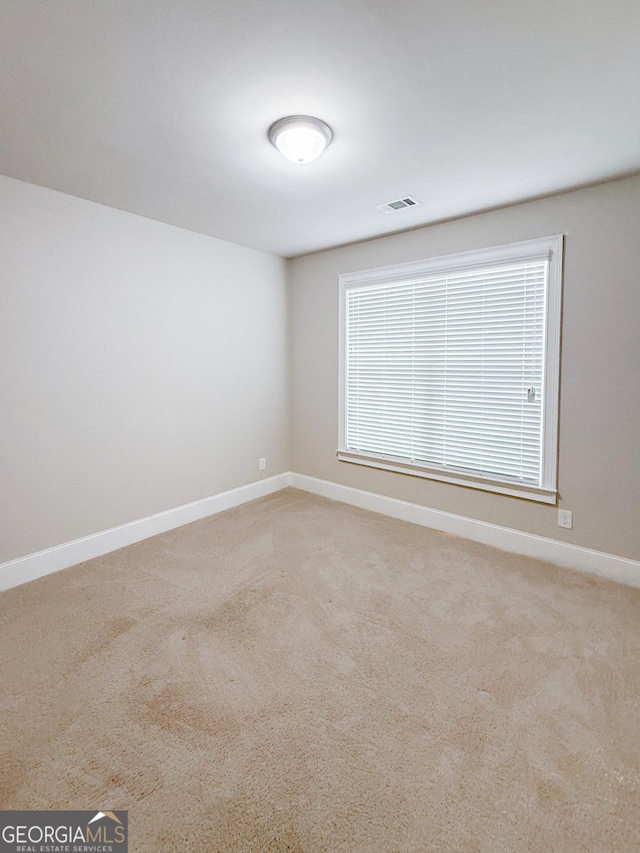 view of carpeted spare room