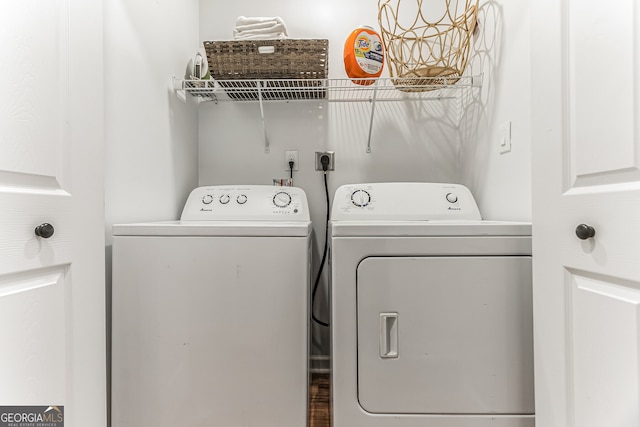 clothes washing area with washing machine and clothes dryer